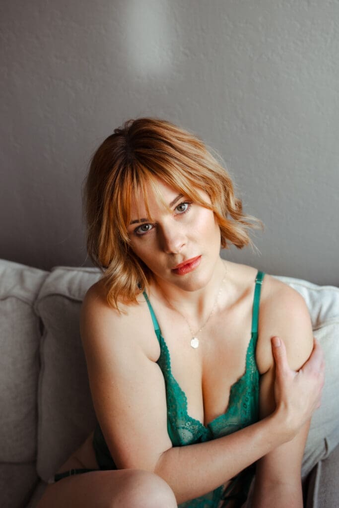 Woman feeling confident and seen during a boudoir photography
session at BB Boudoir in Loveland Colorado
